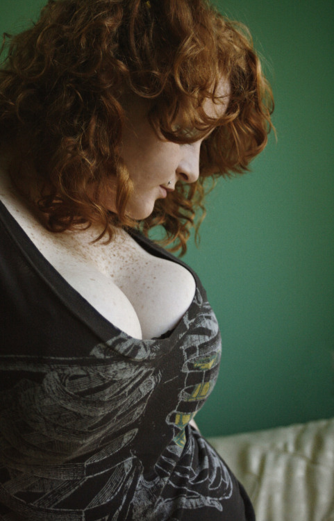 msunsolvedmystery:  Dunno who she is though I’ve seen some of these pics before. Love her curly red hair and big pierced boobs 