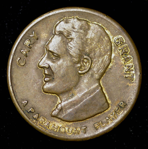 Here’s a rad good luck Swastika coin with the best of Cary Grant on the front, which looks to be a k