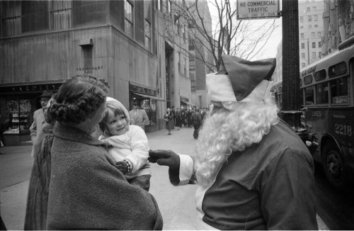 newyorkthegoldenage:A member of Volunteers of America dressed as Santa Claus on Fifth Avenue, Decemb