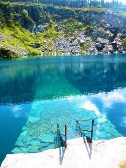 sixpenceee:  This is Portroe Quarry in Tipperary, Ireland. It’s now flooded but it’s a popular location for scuba divers with depths to the region of 40 meters available