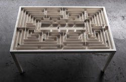 worclip:  Labyrinth Table (2015) by Benjamin Nordsmark  The Labyrinth Table was created to show how a well known object like a table can be given an extra dimension by creating a small universe inside of it. The labyrinth consist of several walls under