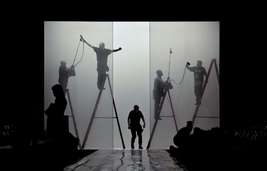 Production crew members work on the final details on the runway set for the showing of the J. Mendel Spring 2014 collection on Wednesday, in New York (Photo by Bebeto Matthews/AP via PhotoBlog)