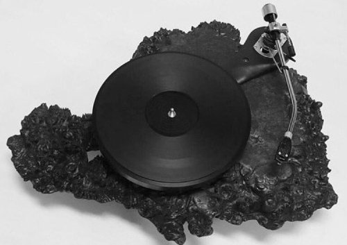 disease:audiowood’s kilauea turntable. partially ebonized, solid maple wood equipped with an SME 12”