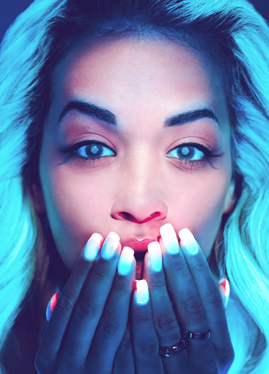 noblebeast:  British singer-songwriter Rita Ora giving off a blue glow under blacklight