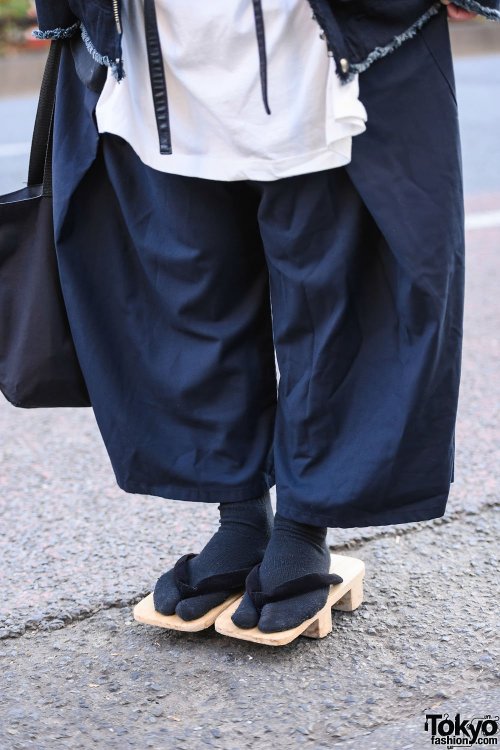 Japanese apparel worker Takamitsu on the street in Harajuku wearing a jacket and top from Not Conven