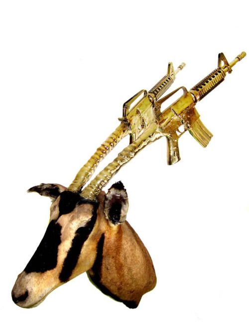 asylum-art-2:   Peter Peter Gronquist’s Taxidermy Gun Antlers  Peter Gronquist makes the  unlikely combination of taxidermy and symbols of power and luxury.  Taking the traditional forms of taxidermy, Peter creates gold and silver  antlers for the stuffed