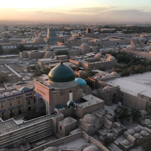 The beautifully preserved fortress city of Khiva at sunset, from the top of a minaret. At one point 