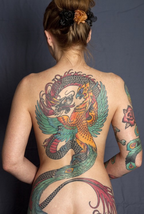 fuckyeahtattoos:  Dragon/Phoenix backpiece by Graham at Purple Panther Tattoos in Hollywood. This is one I’m proud of and would have posted the who,e thing, but modesty forbids…  www.purplepanthertattoos.comhttp://purplepanthertattoo.tumblr.com