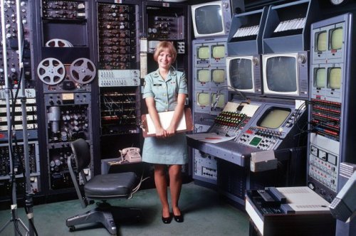 U.S. Army Technician, standing in front of her videotape editing station in 1973