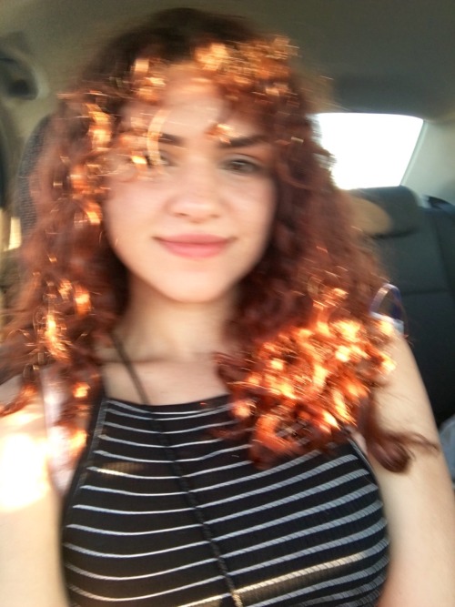 the sun lights my fiery curls