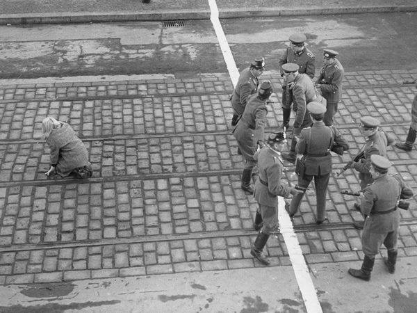 greasegunburgers:  West Berlin policemen and East German Volkspolizei face each other