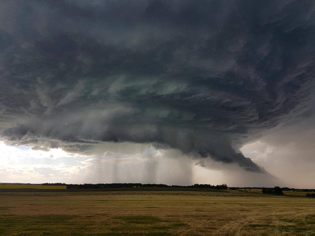 Distant Thunder — Monster, late evening supercell near Halkirk,...