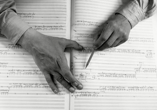 barcarole: Hands of German composer Carl Orff with his score for Antigonae - a musical setting after