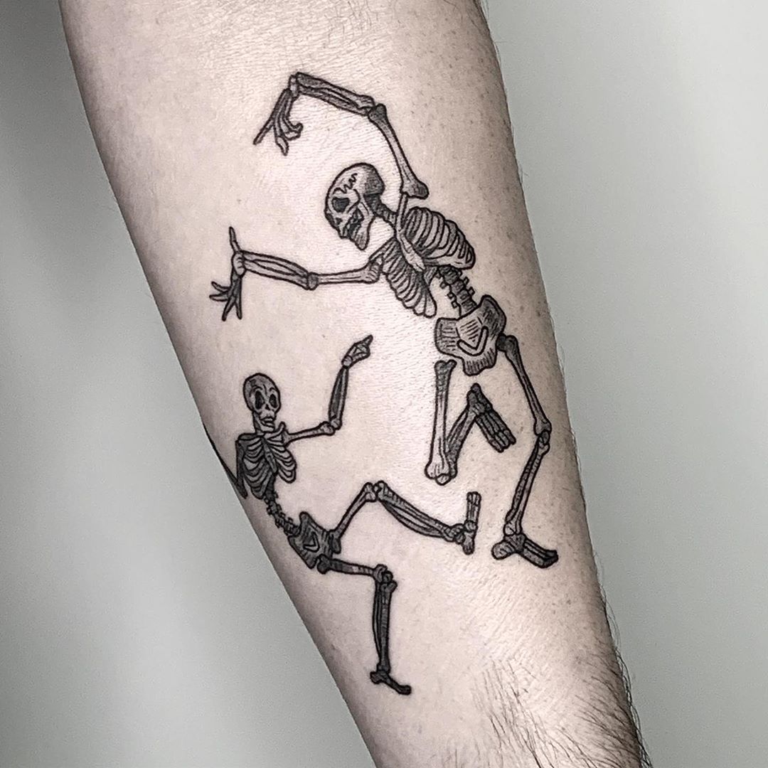 Fine line dancing skeleton tattoo on the ankle