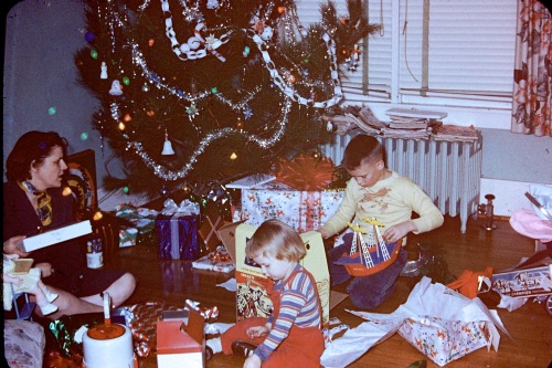My Grandma Marian, mom, and Uncle Bruce opening presents on Christmas morning 1953