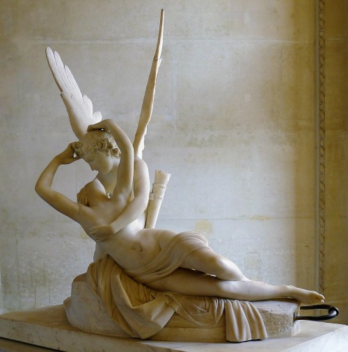 This winged young man who has just landed on a rock where a girl lies unconscious, is the god Eros –