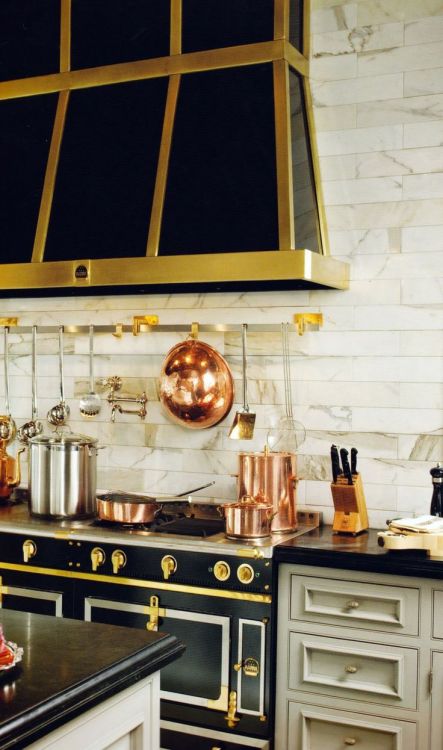 {Some lunch-time inspiration - a Monday Mix of kitchens with beautiful black ranges…}