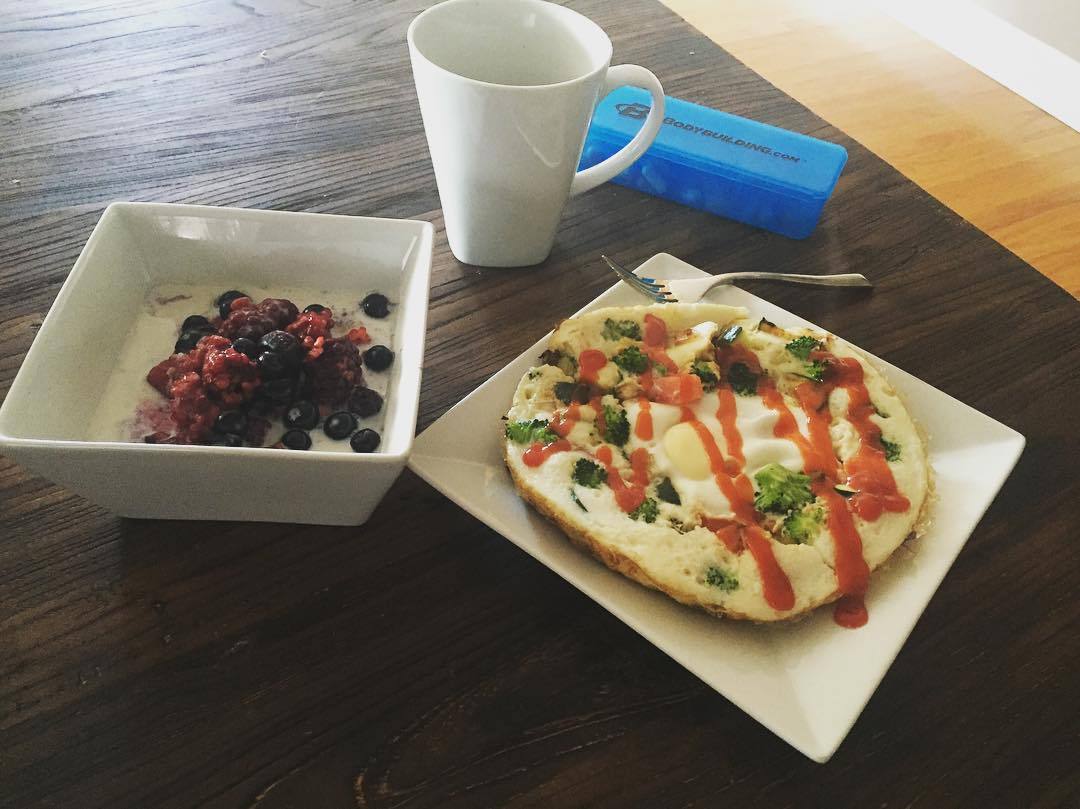 Typical breakfast - egg white and veggie frittata with 1 whole egg, berries and oats,