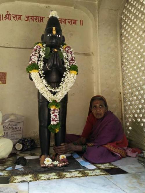 This lovely granny massages Das Maruti&rsquo;s (Hanuman) feet regularly to relieve him from fatigue 