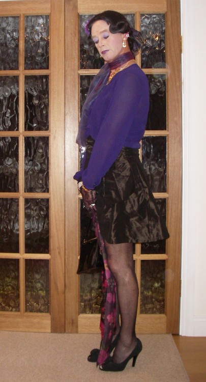 Purple chiffon blouse and satin mini-skirt. The skirt has a pretty bow on the waist. I love my chiff