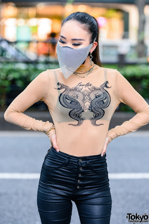 Japanese nurse Saya on the street in Harajuku wearing a chainmail face mask with a sheer top by I.Am