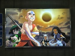 bryankonietzko:  I came into the office today to find another one of those back-lit movie poster things mounted in the garage, this time featuring Lauren Montgomery’s classic A:TLA press art for “The Day of Black Sun.”