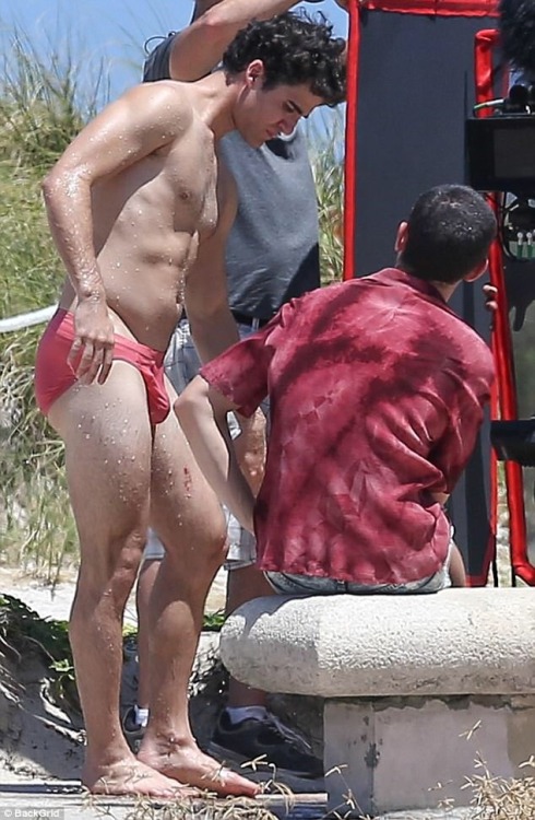 celebritybodybuge:  Darren Criss Part 1 Darren Criss in a red speedo as Andrew Cunanan on the set of The Assassination of Gianni Versace; American Crime Story.