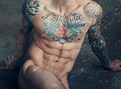 dominicanblackboy:  Sexy gorgeous hot tatted muscle ass Adam Von Rochfelder naked while the picture moves! 