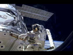 8bitfuture:  The ISS celebrated 15 years in orbit this week. Astronaut James H. Newman waves during a spacewalk preparing for release of the first combined elements of the International Space Station. The Russian-built Zarya module, with its solar array