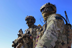 militaryarmament:  Australian Combat Controllers from the No. 4 Squadron secure their gear and prepare for training after parachuting from a C-130J Hercules in to Delamere Range Facility in the Northern Territory during Exercise Pitch Black 2014. August