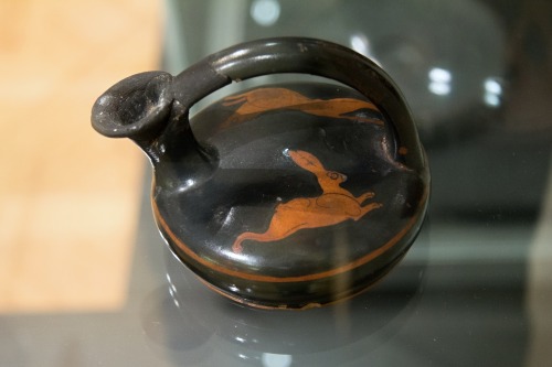 A dog pursues a hare.  Attic red-figure askos, artist unknown; ca. 475-450 BCE.  Now in th