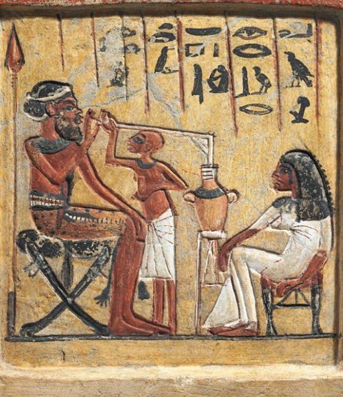Ancient Egyptians drinking beer, circa 1350 BC.