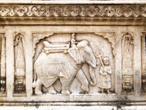 A beautiful relief on an elephant in the entrance of a Krishna Temple in the winding roads of the wa