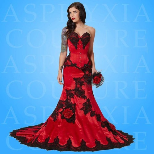 Red delustered satin and black alencon lace bridal corsetted gown. For all orders & enquiries, p