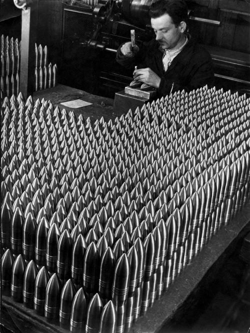 Czech worker in a Skoda ammunition factory with 15cm granules (Plzeň, June 1938).  Škoda