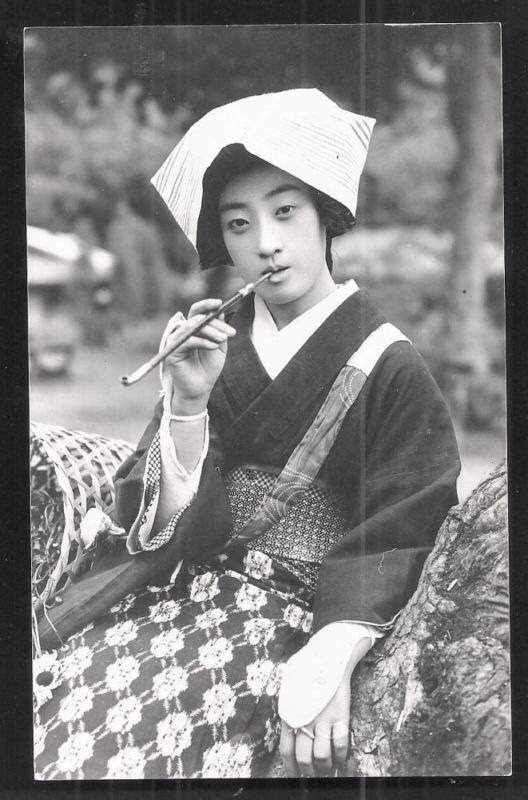 kikikimono:  Postcard of farmer girl smoking pipe- Japan 1920s