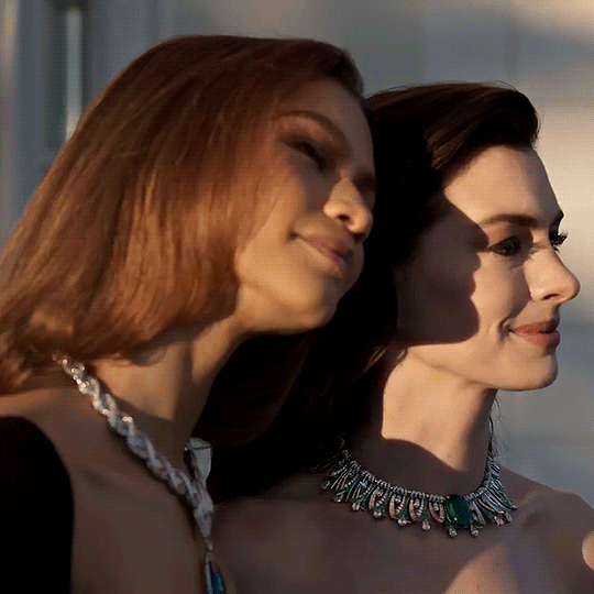 A square gif of a close-up side shot of Zendaya and Anne Hathaway. Zendaya’s head is resting against Anne’s.