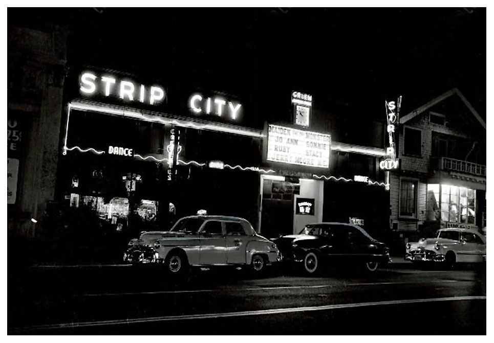 STRIPTEASE BOOM! Vintage press photo dated from April of ‘51, features the neon-lit