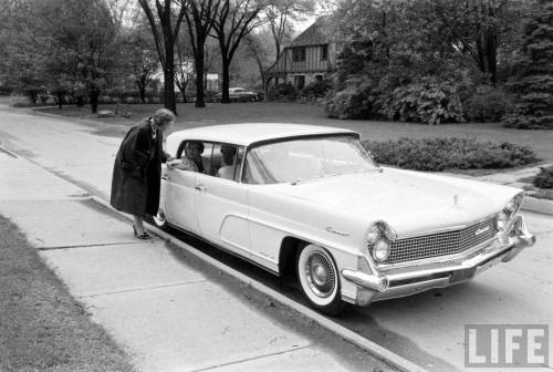 Real estate agents in Evanston in a very white car(J.R. Eyerman. 1960)