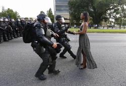 sauvamente:  sauvamente:  frontpagewoman:  This picture is breaking Twitter: Woman confronts police at BLM protest in Baton Rouge, Louisiana. Who is she?✊