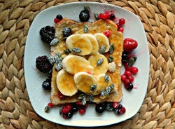 seedsnsmiles:  Wholewheat French toast with cinnamon and flaxseed, sliced banana, mixed berries, pumpkin seeds and a drizzle of maple syrup. 