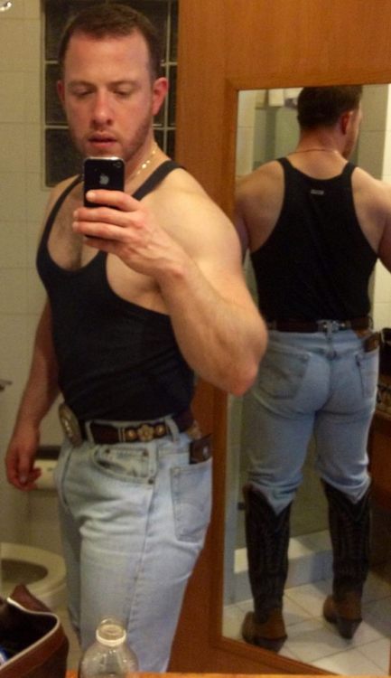 bootslaveboyusa:  Yeah cowboy the taller the boots the more to make this faggot lick.