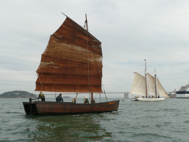 Grace Quan, a wooden sailboat with a single mast, at sail on San Francisco Bay. Image courtesy of San Francisco Maritime National Historic Park.