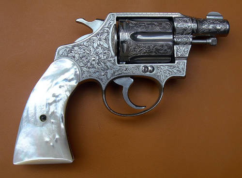 pimpingweapons:Factory engraved Colt Detective Special with pearl grips.