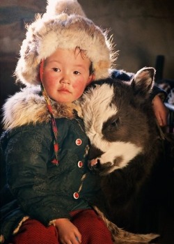 scootermoto:  universalbeauty:  Nomadic Mongolian Boy~  and his friend mr. calf 