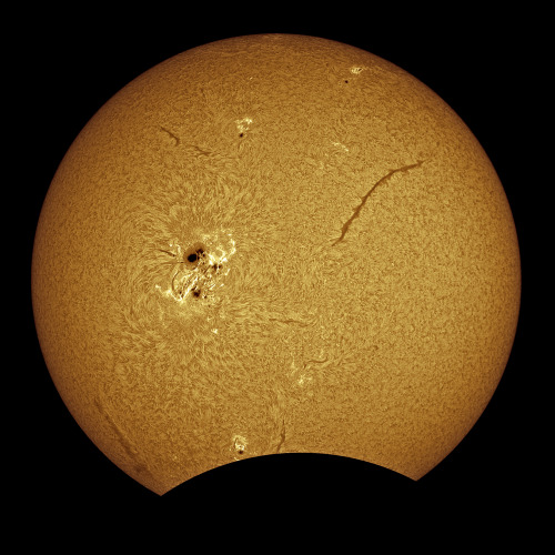 Five years ago today… a HUGE sunspot being gobbled up by the moon.