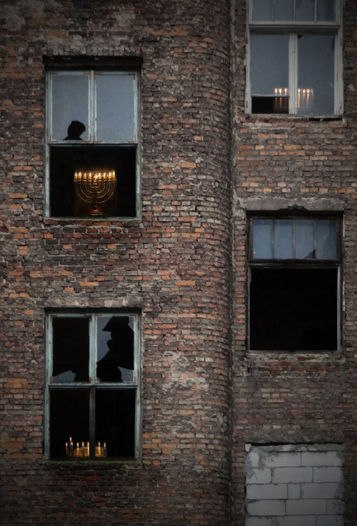 punkpoisonivy: haaretz: Where the Warsaw Ghetto once stood, Hanukkah candles light the night &lt