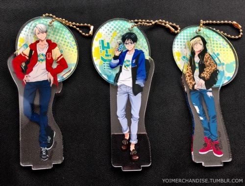 yoimerchandise: YOI x Movic Acrylic Keychains with Bases Original Release Date:December 2017 Featured Characters (3 Total):Viktor, Yuuri, Yuri Highlights:This set of keychains & bases feature the main trio in hoodies and backpacks. The visuals were