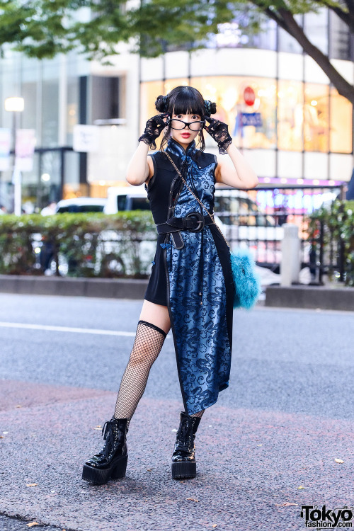 Harajuku shop staffer Misuru on the street wearing a twin buns hairstyle, black lace gloves, a Qutie