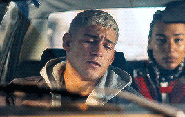 Brows Furrow And Eyes Narrow Into Slits As Grayson Looks Over At The Brunette , Sporting An Unimpressed